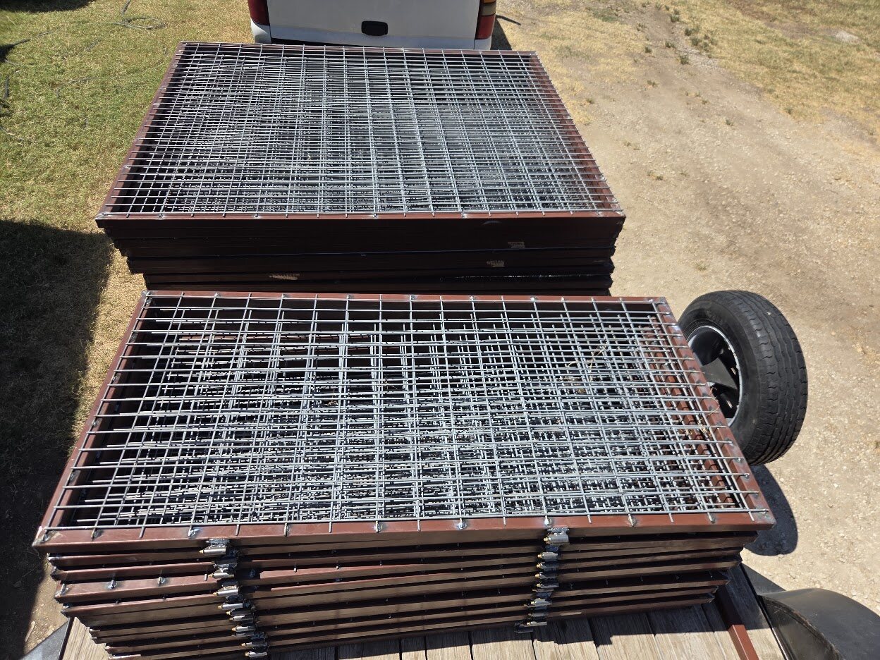 Finished fabricated kennel panels prepared for transport